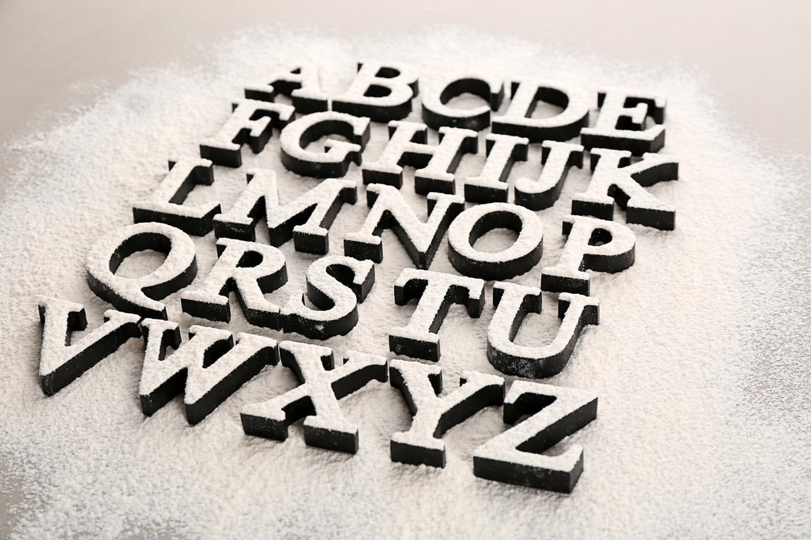 Alphabet Letters on a Scattered Flour